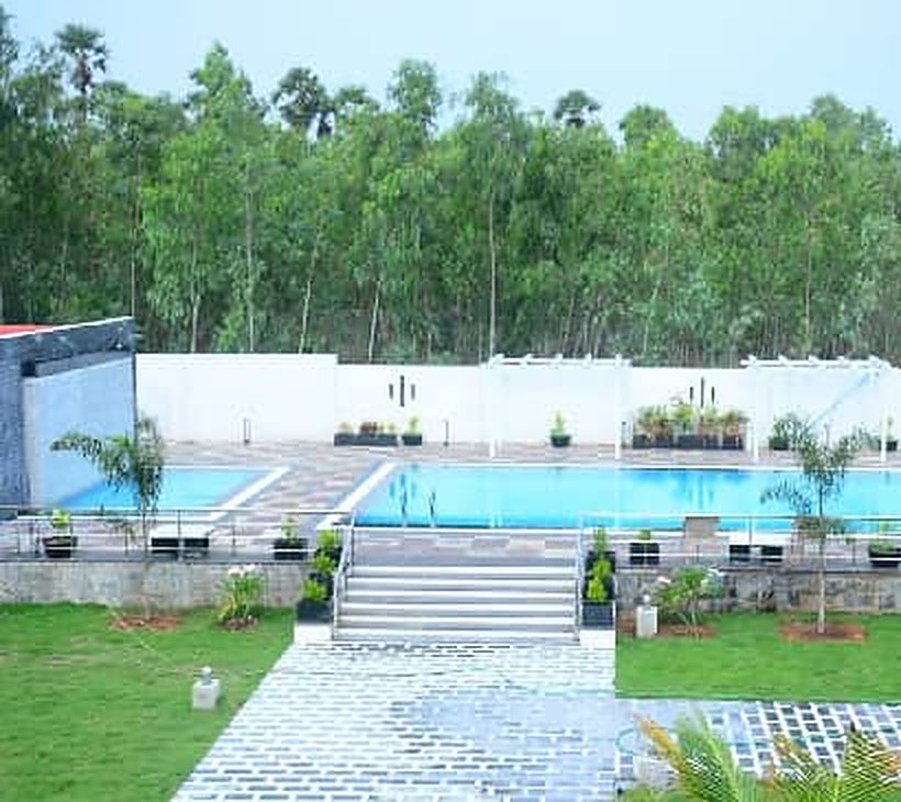 Swimming pool with steps and lawn at Myra Golden Beach Resort